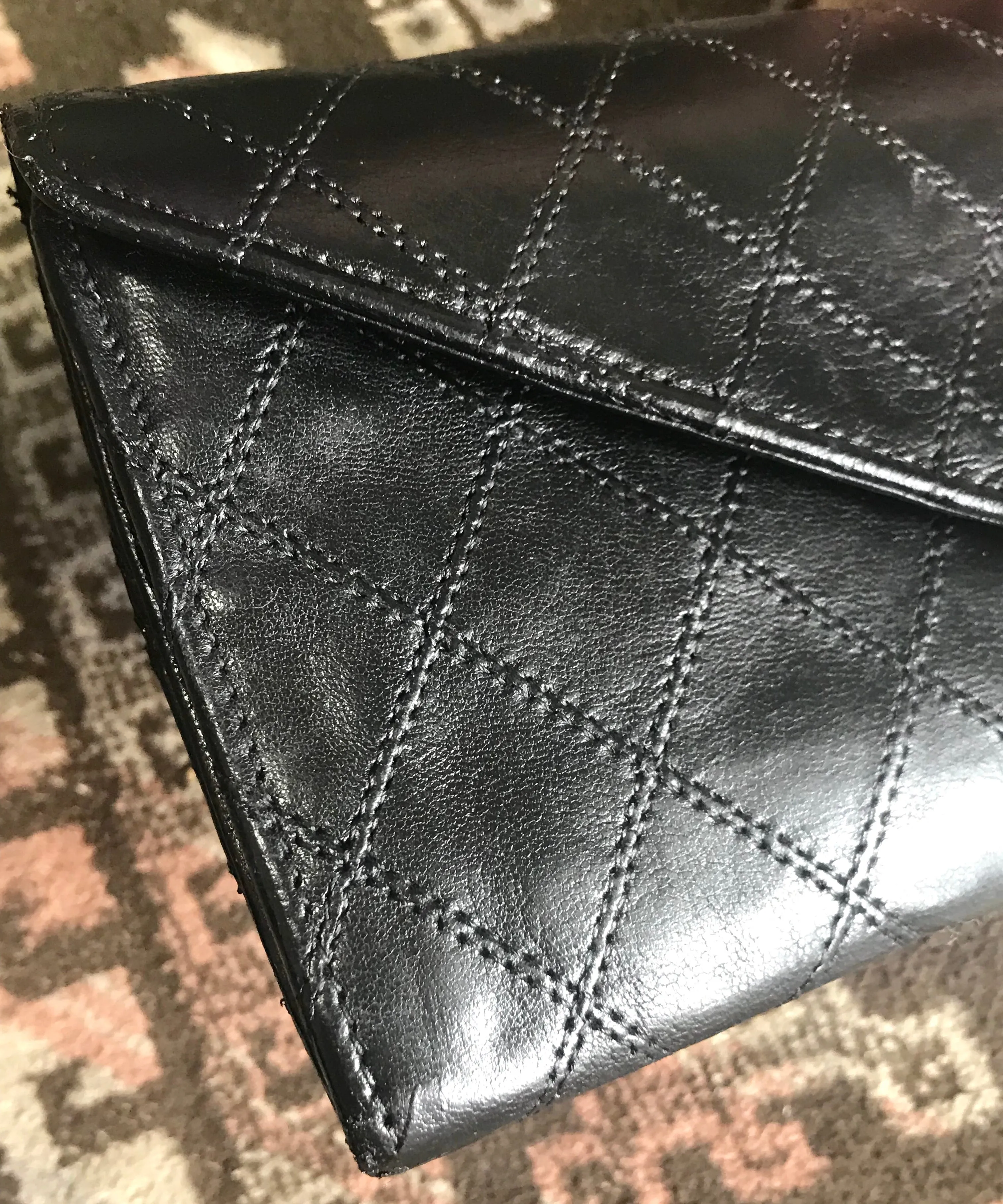 1980s. Vintage CHANEL black goatskin bill, card, checkbook long wallet pouch purse with  mini CC motif.  Classic unisex style.