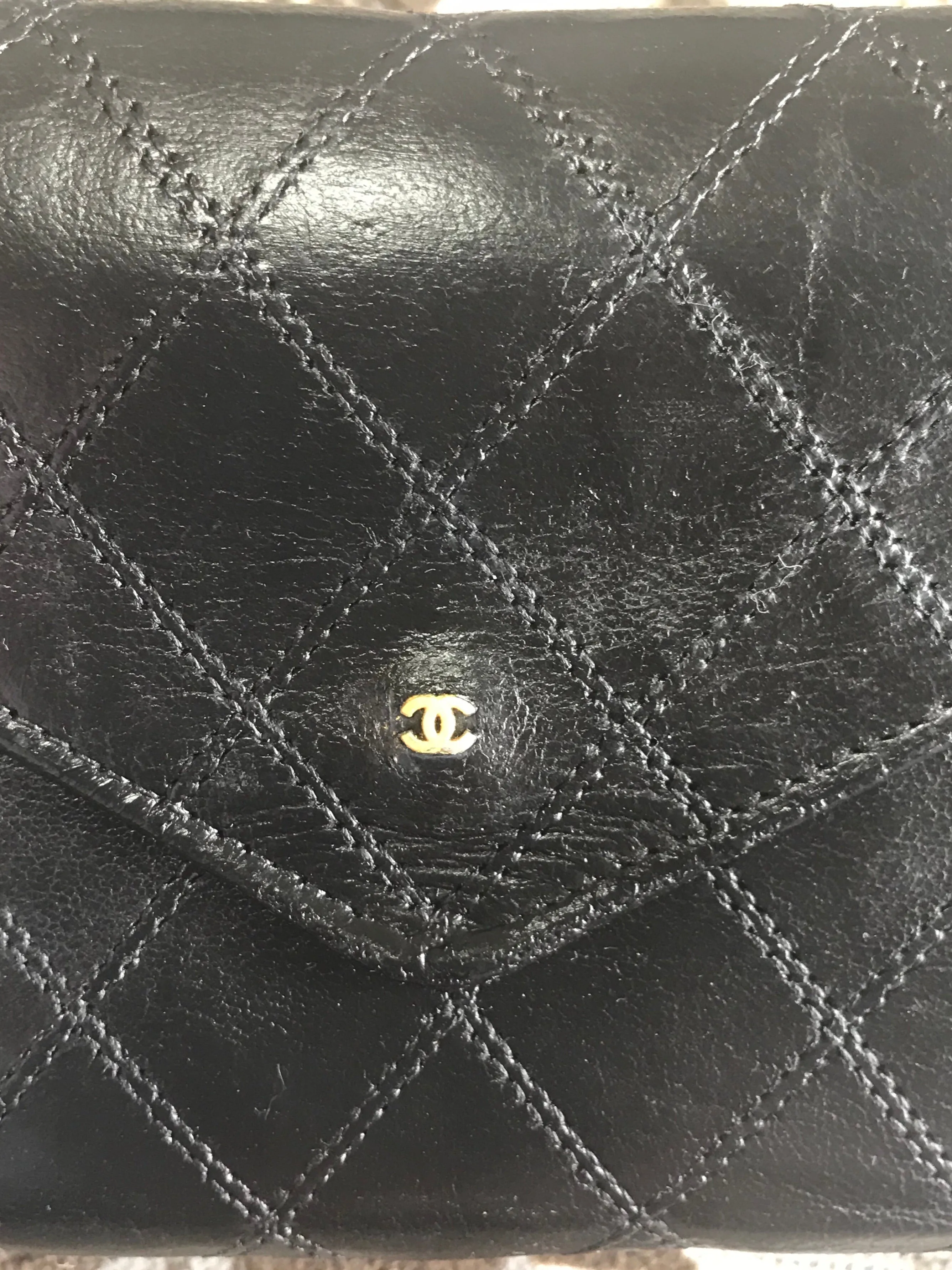 1980s. Vintage CHANEL black goatskin bill, card, checkbook long wallet pouch purse with  mini CC motif.  Classic unisex style.